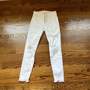 HIGH RISE WHITE RIPPED SKINNY JEANS NEXT LEVEL STRETCH AMERICAN EAGLE